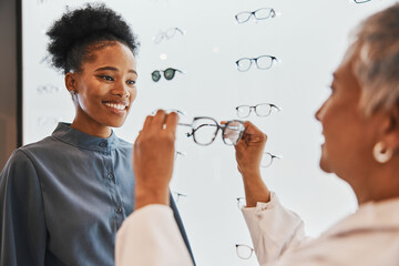 Vision, optician and black woman shopping for glasses in optometry store or shop for ophthalmology....