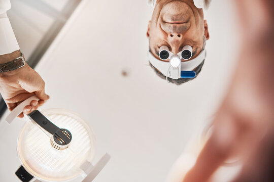 Eye Exam, Flashlight And Face Of Optometrist Looking Down To Patient For Vision Test, Eyesight And Optical Exam Ophthalmology, Clinic And Man In Consultation For Retina, Eyes And Medical Surgery