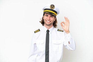 handsome Airplane pilot isolated on white background showing ok sign with fingers