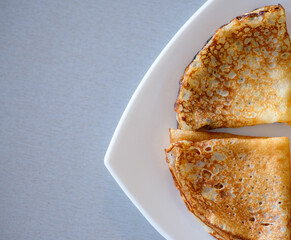 Pancakes. Shrovetide. Pancakes on a white plate. Delicious pancakes. Russian pancakes. Delicious dessert. Dinner. Breakfast.