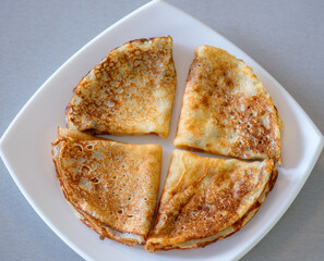 Pancakes. Shrovetide. Pancakes on a white plate. Delicious pancakes. Russian pancakes. Delicious dessert. Dinner. Breakfast.