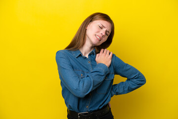 Young English woman isolated on yellow background suffering from pain in shoulder for having made an effort
