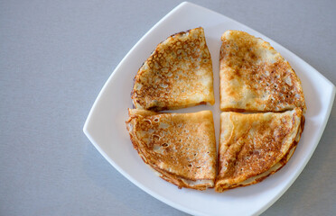 Pancakes. Shrovetide. Pancakes on a white plate. Delicious pancakes. Russian pancakes. Delicious dessert. Dinner. Breakfast.