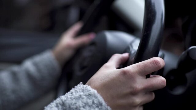 Woman Driver Hand On Car Steering Wheels