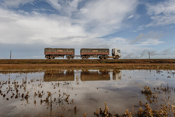 road with a truck and a watering role 