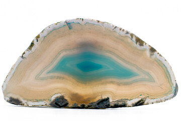 White and light Blue semi-transparent agate slice crystal, banded chalcedony stone isolated on a...