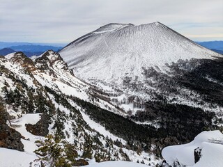 Active volcano Mt. Asama seen from Mt. Jakotsu on the outer rim in January. Komoro City, Nagano...