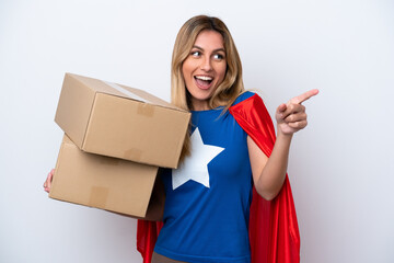 Super Hero delivery woman isolated on white background pointing finger to the side and presenting a...