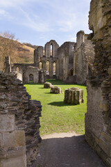 The ruins of Valle Crucis Abbey viewed dining hall. Founded as a Cistercian monastery in 1201 and closed in 1537 it is a prominent landmark in the vale of Llangollen Wales