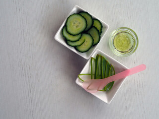 Cucumber juice along with some aloe vera gel well mixed in a bowl isolated on white background.