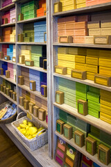 Store showcase with colorful handmade soap on a french market