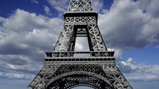  Eiffel Tower in Paris, France (against the background of moving clouds), time lapse