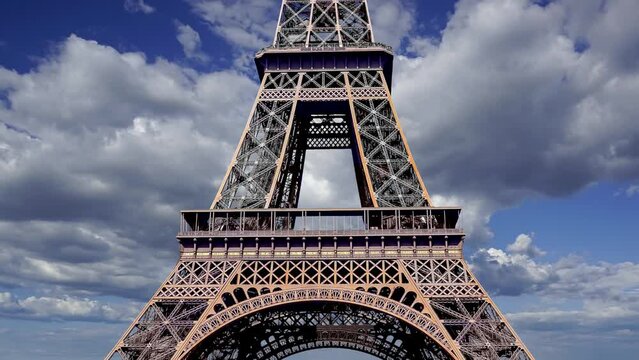  Eiffel Tower in Paris, France (against the background of moving clouds), time lapse