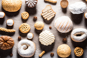 Fototapeta na wymiar Different fresh and tasty bakery products. Top view home made buns and cookies. Pastry food collection. Flat lay composition. AI generative image.