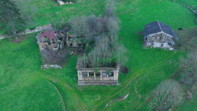 Abandoned buildings of the old Doctor Madrazo Surgical Sanatorium, aerial view from a drone, in the town of Vega de Pas in the Valles Pasiegos. Cantabria, Spain, Europe