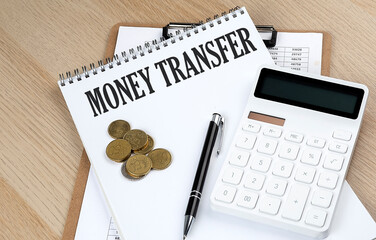 MONEY TRANSFER text with chart and calculator and coins , business concept