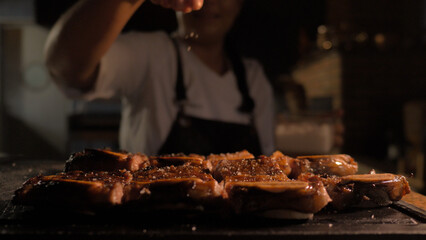 Chef cooking himself preparing Wagyu barbecue