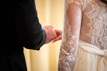 hands, wedding rings and marriage vows