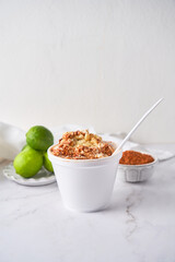Mexican snack, prepared esquite, corn in a cup, with chili
