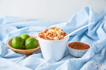 Mexican snack, prepared esquite, corn in a cup, with chili