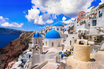 Santorini,  Oia village, Cyclades . Greece. Iconic view with blue domes and caldera of most beautiful island