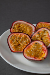 ripe organic passion fruit on a dark background