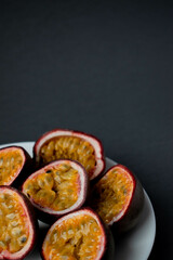 ripe organic passion fruit on a dark background