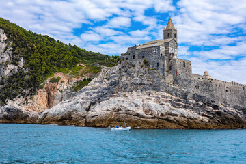 Fototapeta na wymiar Porto Venere, Italy with church of St. Peter on cliff.