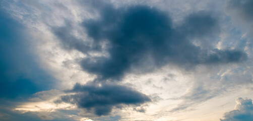 Dark skies and dramatic sunsets. Wide photo.