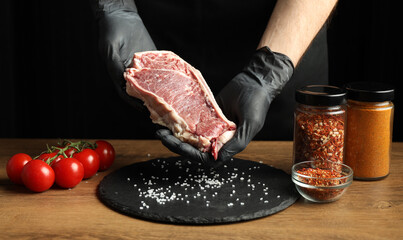 Fresh raw meat for steak with salt and spices.