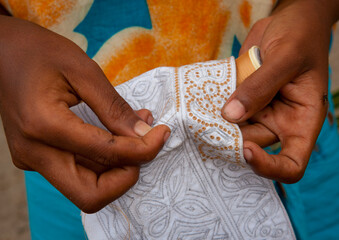 Swahili woman sewing a kofia, Lamu County, Lamu, Kenya