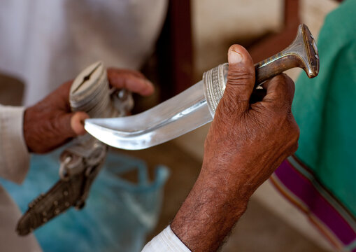Man Checking A Khanjar, Sinaw, Oman