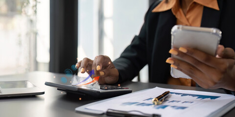 Accountant black woman working on laptop and do document, tax, exchange, accounting and Financial...