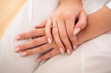 Fototapeta na wymiar hands, wedding rings and marriage vows