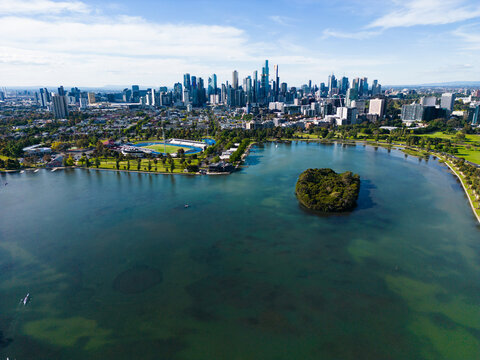 Aerial image above Albert Park Lake looking towards the Melbourne city centre