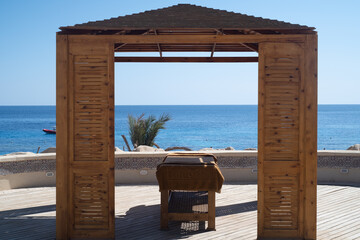 Fototapeta na wymiar Massage table with sea view