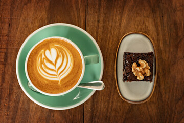 Cup of cappuccino and brownie top view