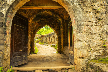 Fototapeta na wymiar Old gate to Rudkhan castle in north east Iran - popular famous tourism destination in Persia