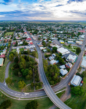Vertical panorama of bridge and underpass with New England Highway leading through town of Singleton