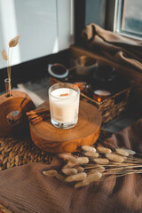 Burning candle in home interior, aesthetics