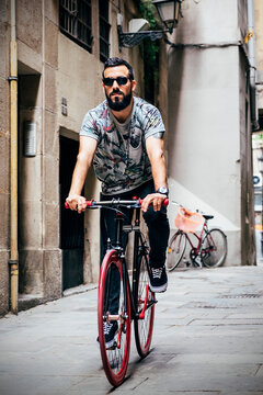 Guy riding bike on street