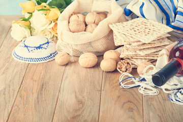 Passover celebration concept. Matzah, red kosher and walnut. Traditional ritual Jewish bread...
