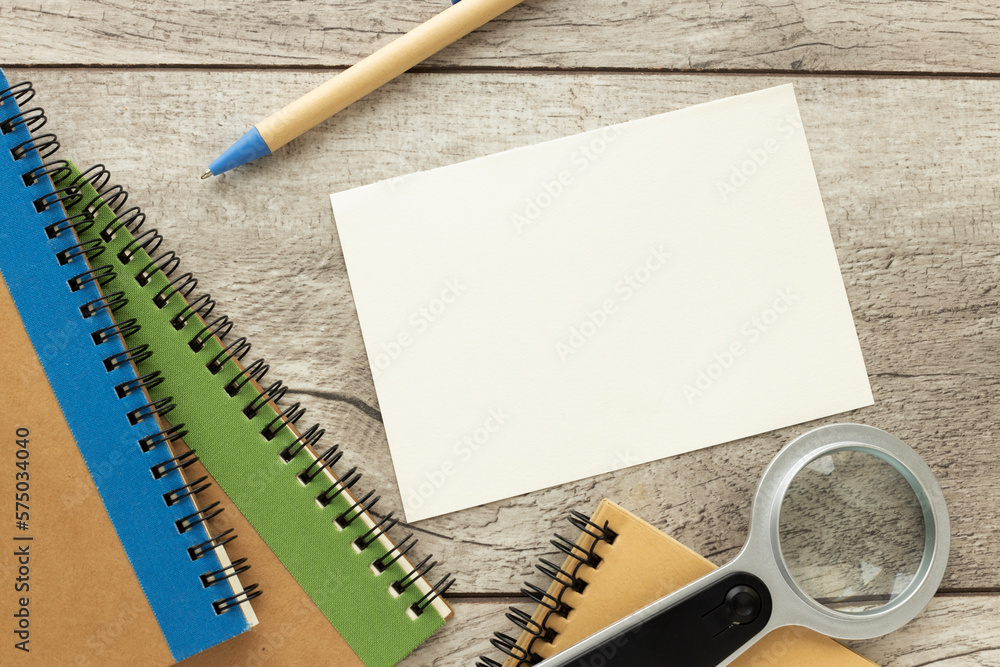 Poster top view of office desk workspace with supplies and blank a4 paper in the middle. modern minimal des
