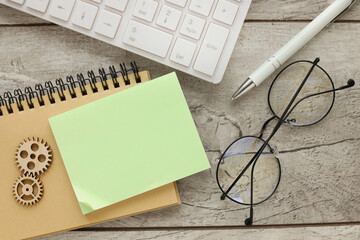 paper note on notepad near white keyboard