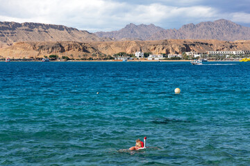 Snorkeling woman with mask in Red sea, Sharm El-Sheikh, Egypt