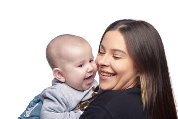 Young girl with a baby in her arms, joy with a newborn laughing