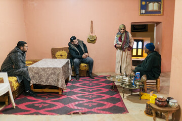 Berber family gathering and bonding in the living room for tea time