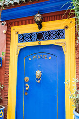Blue and Yellow Door with Private Sign