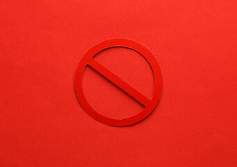 Prohibition sign on red background. Close up