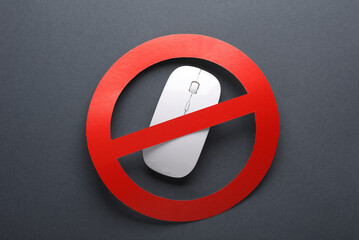 Pc mouse with prohibition sign on a dark background